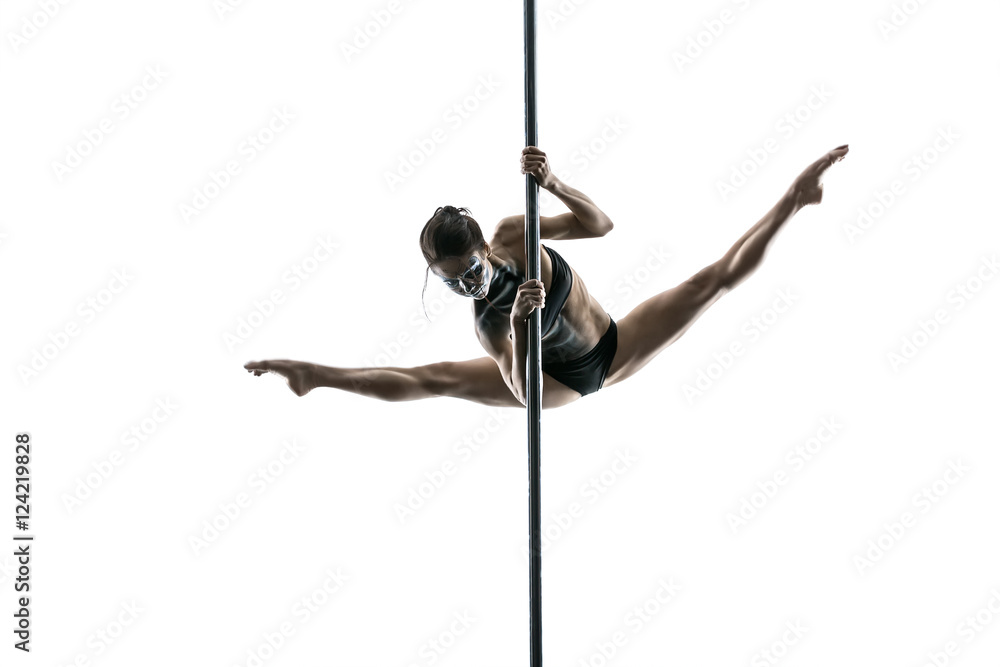 Female pole dancer posing in studio - obrazy, fototapety, plakaty 