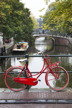 Red Bike On A Bridge In Amsterdam