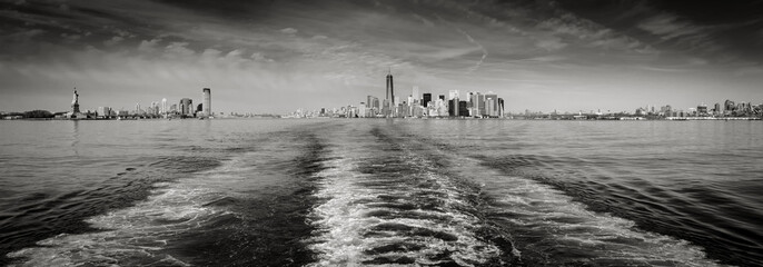 Wall Mural - New York cityscape encompassing Lower Manhattan with Battery Park and the Financial District skyscrapers, downtown Jersey City and Brooklyn. Black & White panoramic. New York City