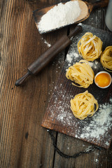 Canvas Print - Raw pasta with ingredients for pasta