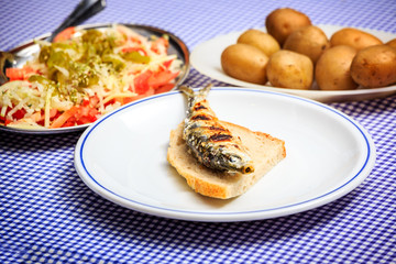 Wall Mural - Grilled sardines with salad, bread and potato