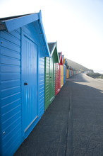 Row Of Brightly Coloured Beach Huts