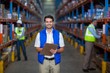Warehouse worker holding clipboard