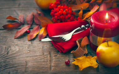 Wall Mural - Thanksgiving table decorated with bright autumn leaves