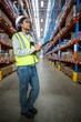 © WavebreakMediaMicro - Female warehouse worker looking at packages