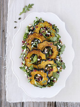 Roasted Acorn Squash Salad With Spicy Pepitas And Cranberries