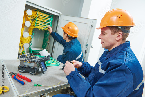 Fotomural internet connection. fiber optic cable splice machine in work