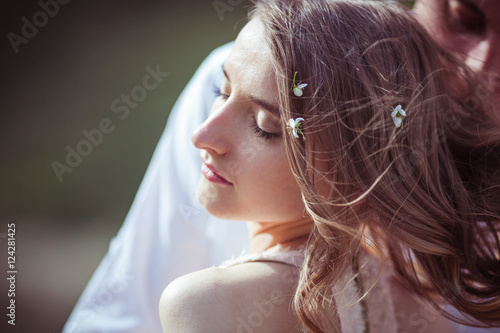 Tiny White Flowers Lie In Woman S Hair While She Enjoys Spring S