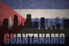 Abstract Silhouette Of The City With Text Guantanamo At The Vintage Cuban Flag