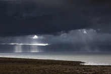 Sunbeams Shine Through Dark Storm Clouds Over The Water;Applecross Peninsula Highlands Scotland