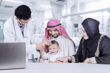 Wall Mural - Arabian family at clinic