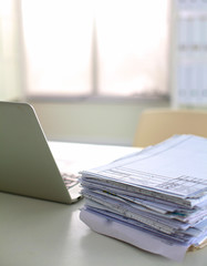 office desk a stack of computer paper reports work forms