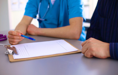 doctor and patient at the table. solution