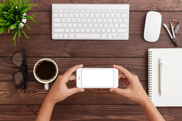 Aufkleber - hand holding phone horizontal showing phone blank screen on work