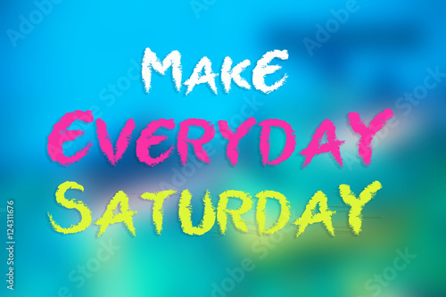 MAKE EVERYDAY SATURDAY word card on blurred blue background Stock