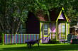 Colorful cabin and fence