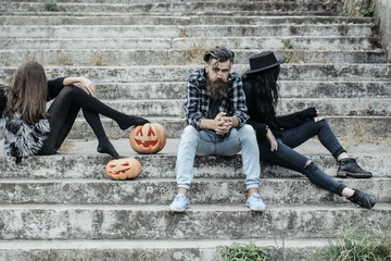 Wall Mural - halloween man and girls with pumpkin