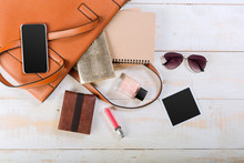 View On Women Bag Stuff On Wooden Background
