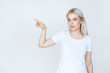 © kegfire - teenage girl in white t-shirt pointing finger away