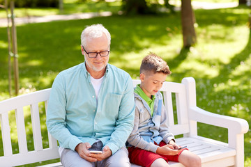 Poster - old man and boy with smartphones at summer park