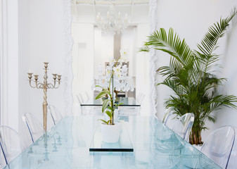 Beautiful flowers in vase on table in room