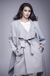© dorriss - Beautiful young woman in an elegant gray coat