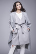 © dorriss - Beautiful young woman in an elegant gray coat