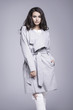 © dorriss - Beautiful young woman in an elegant gray coat