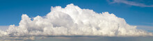 Blue Sky With Big Fluffy Cumulus Cloud Wide Panoramic Background