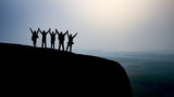 Fototapeta Sport - silhouette group of young people on top of the mountain