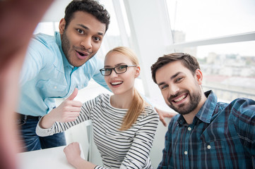 Group shot of colleagues having fun in their office