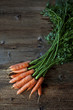 © The Picture Pantry - Bunch of carrots on a wooden table