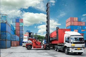 Wall Mural - Forklift lift container box loading to truck in depot 