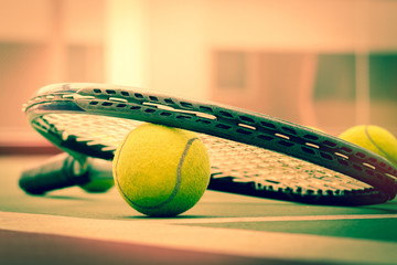 Tennis Ball with Racket on the clay tennis court