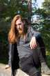 © Rob Rye - Portrait of man with a long beard and a long hair on the bridge