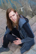© Rob Rye - Portrait of man with a long beard and a long hair on the stairca