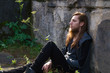 © Rob Rye - Portrait of man with a long beard and a long hair near the wall