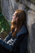 © Rob Rye - Portrait of man with a long beard and a long hair near the wall