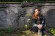 © Rob Rye - Portrait of man with a long beard and a long hair near the wall