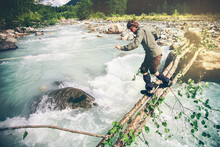 Man Traveler Crossing Over River On Woods Outdoor Lifestyle Travel Extreme Survival Concept