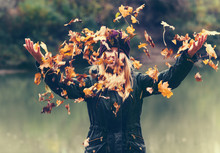Young Woman Playing With Autumn Leaves In Park Raised Hands Walking Outdoor Lifestyle Nature On Background