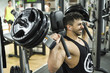 © FotoAndalucia - Young man lifting weights in gym