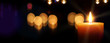 Kerze - adventskerze auf dunklem Hintergrund mit Unschärfe