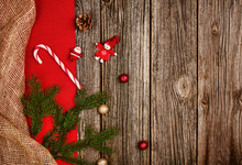 Christmas Decoration Background Over Wooden Table With Red And Linen Cloth.