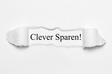 Sticker - Clever Sparen! auf weißen gerissenen Papier