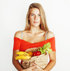 young pretty blond woman at shopping with food in paper bag isol