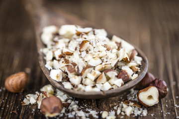 Canvas Print - Chopped Hazelnuts (selective focus)