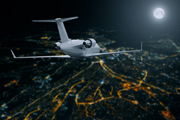 Wall Mural - Passenger airplane flying over city at moon night