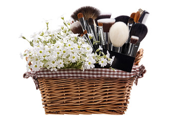 Wall Mural - Makeup brushes set in crib with flowers. Chickweed. Isolated. Wh