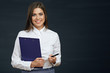 © Yuriy Shevtsov - Smiling business woman holding clipboard with pen.